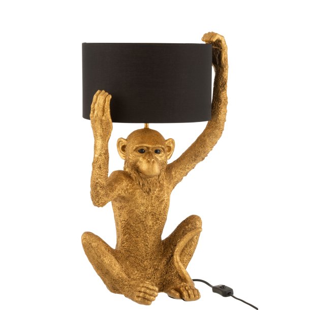 Bordlampe i guld med abe, der holder skrm